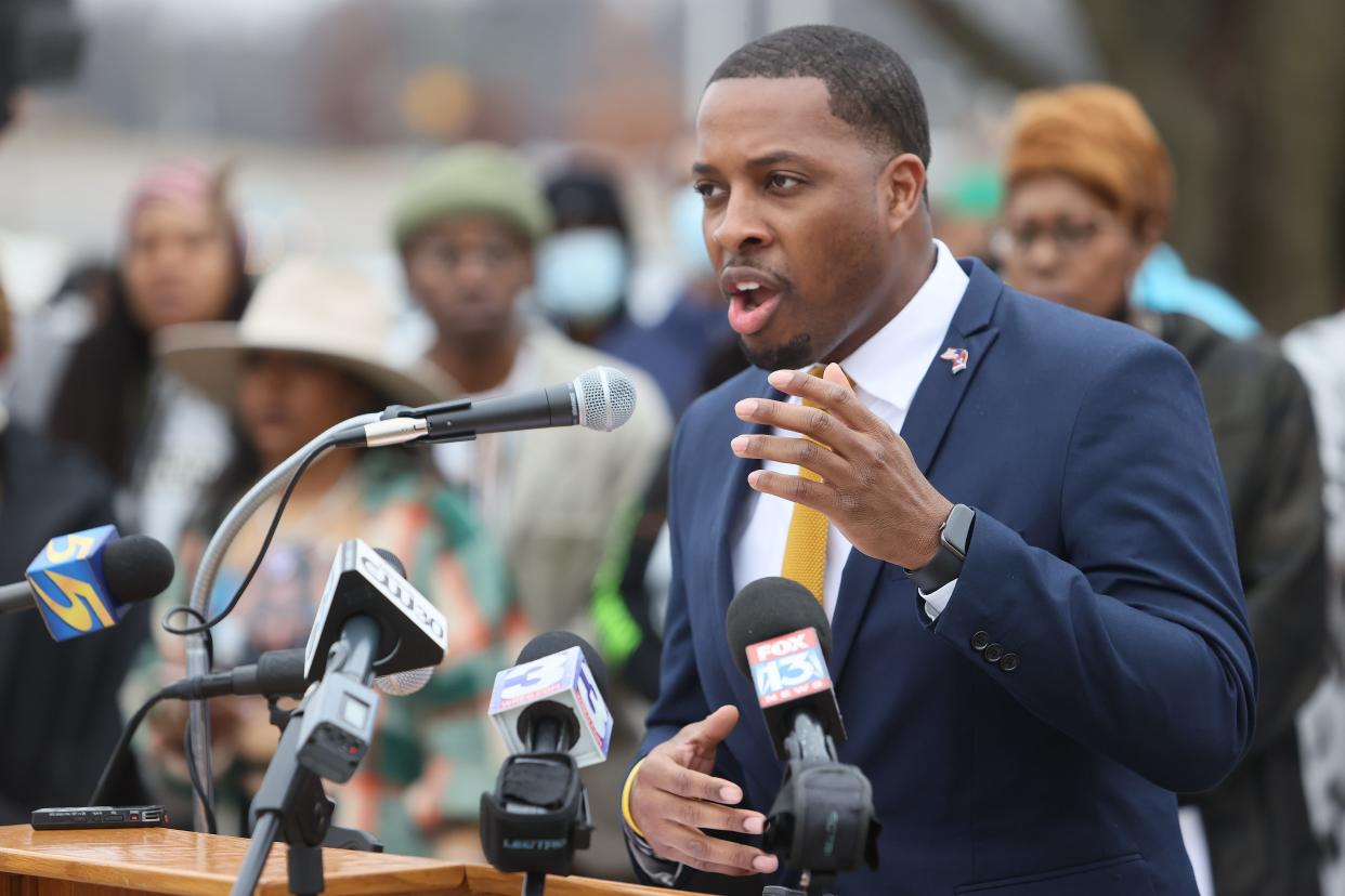 JB Smiley Jr. speaks to people during a ceremony renaming a Memphis street to honor the late rapper Young Dolph on Wednesday, Dec. 15, 2021.