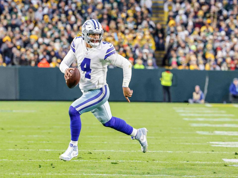 Dak Prescott looks to throw against the Green Bay Packers.