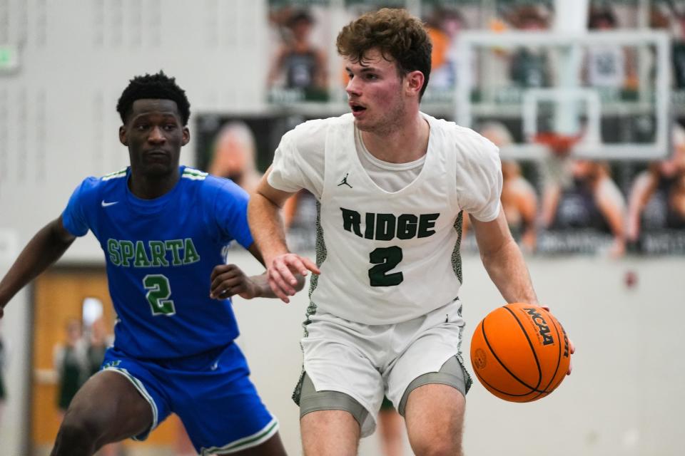 Fossil Ridge's Matthew Boldt dribbles in a second-round high school basketball playoff game Feb. 25 against Doherty at Fossil Ridge High School in Fort Collins.