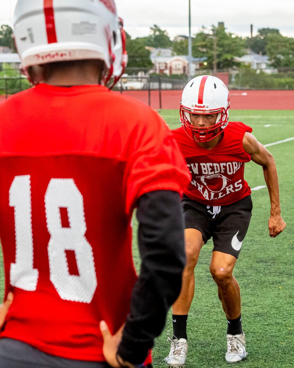 New Bedford's Dezmond Brunskill works on his footwork for the secondary unit at training.