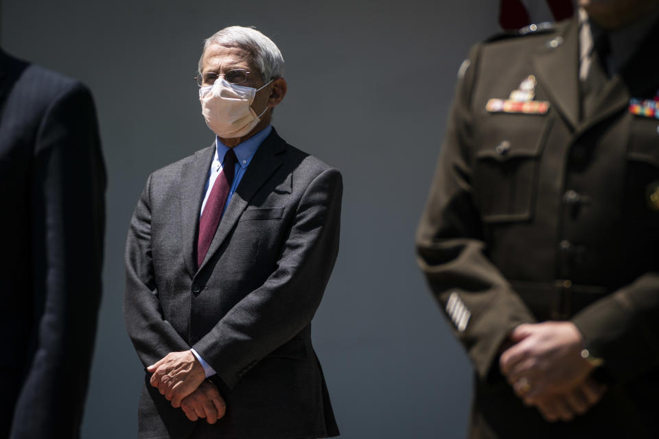 Director of the National Institute of Allergy and Infectious Diseases Dr. Anthony Fauci, wearing a face mask, listens as President Donald J. Trump participates in a vaccine development event in the Rose Garden at the White House on Friday, May 15, 2020 in Washington, DC. (Jabin Botsford/The Washington Post via Getty Images)