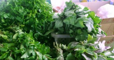 A green herb called usma sells for $.06 a bunch at markets and can be used to create the illusion of a unibrow for those who are not genetically blessed with bushy brows. Photo via Global Post.