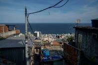 In the favelas, solar power is an alternative to dangerous, clandestine electricity connections known as 'gatos' (AFP/MAURO PIMENTEL)