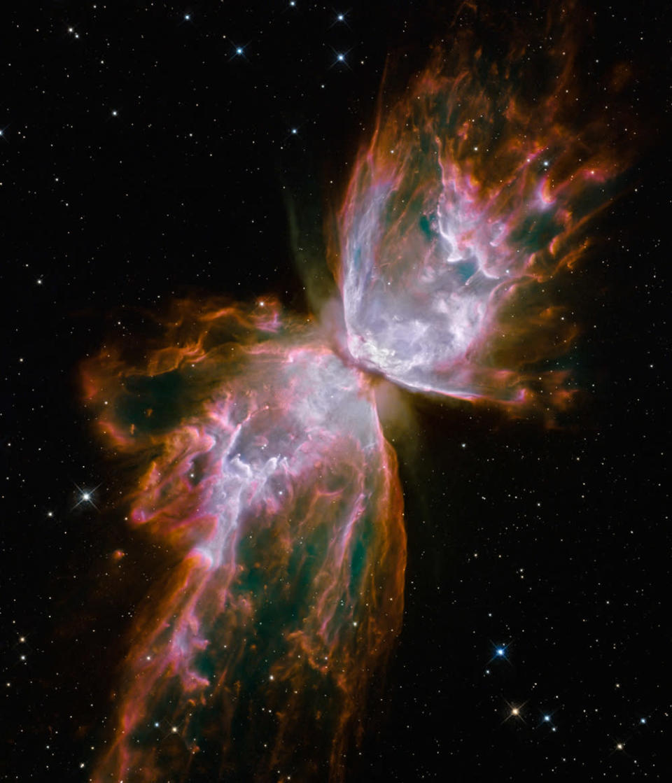 The death of a star very much like the Sun allows us to glimpse our own distant future. As the star’s internal nuclear furnace begins to fail its outer layers are expelled back into space, forming a beautiful ‘Planetary Nebula’. Hubble’s camera is equipped with special colour filters to isolate the light from various chemicals. This image has been coloured to highlight nitrogen in red and sulphur in white (The Butterfly Nebula (NGC 6302) © NASA/ESA and the Hubble SM4 ERO Team)