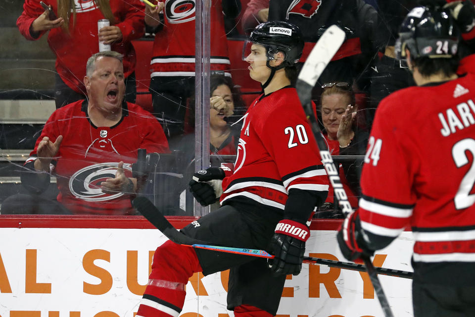 Carolina Hurricanes' Sebastian Aho (20) celebrates his goal against the Buffalo Sabres during the second period of an NHL hockey game in Raleigh, N.C., Thursday, April 7, 2022. (AP Photo/Karl B DeBlaker)