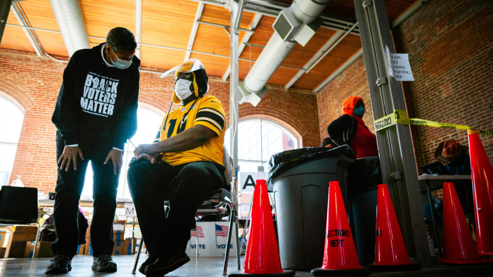 Election officials chat in the polling area in the Kentucky Center for African American Heritage on Nov. 3, 2020, in Louisville, Kentucky. (Photo: Jon Cherry via Getty Images)