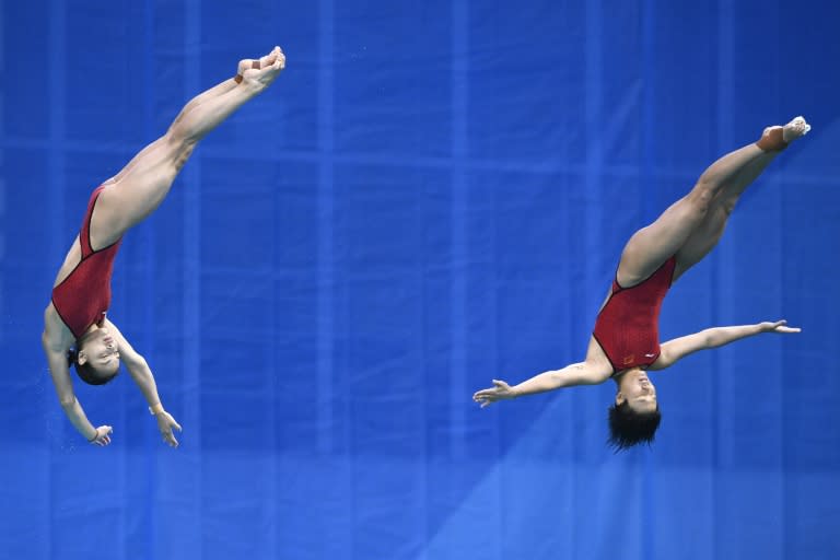 China's Wu Minxia and China's Shi Tingmao compete in the Women's Synchronized 3m Springboard Final during the diving event at the Rio 2016 Olympic Games at the Maria Lenk Aquatics Stadium in Rio de Janeiro on August 7, 2016