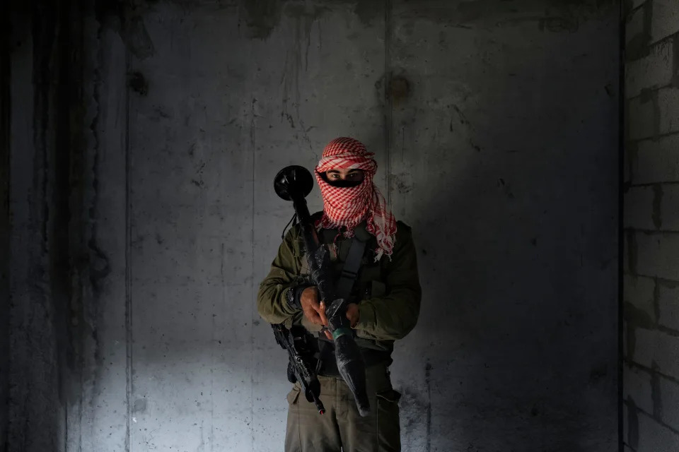 An Israeli soldier dressed as a Palestinian militant, poses for a photo during training session simulating urban warfare at the Zeelim army base, southern Israel Jan. 4, 2022.