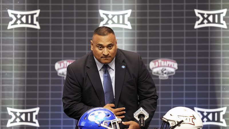 BYU coach Kalani Sitake sits before speaking at the Big 12 football media days in Arlington, Texas, Wednesday, July 12, 2023.