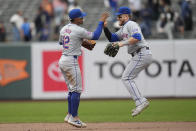 New York Mets' Francisco Lindor, left, celebrates with Harrison Bader after the Mets defeated the San Francisco Giants in a baseball game in San Francisco, Wednesday, April 24, 2024. (AP Photo/Jeff Chiu)