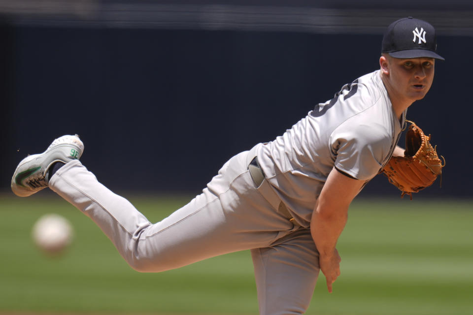 New York Yankees starting pitcher Clarke Schmidt works against a San Diego Padres batter during the first inning of a baseball game, Sunday, May 26, 2024, in San Diego. (AP Photo/Gregory Bull)