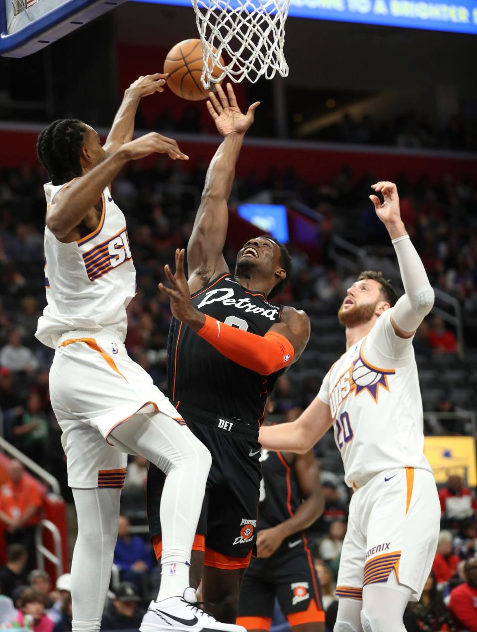 Detroit Pistons center Jalen Duren (0) has his shot blocked by Phoenix Suns forward Keita Bates-Diop (21) during first-quarter action at Little Caesars Arena in Detroit on Sunday, Nov. 5, 2023.