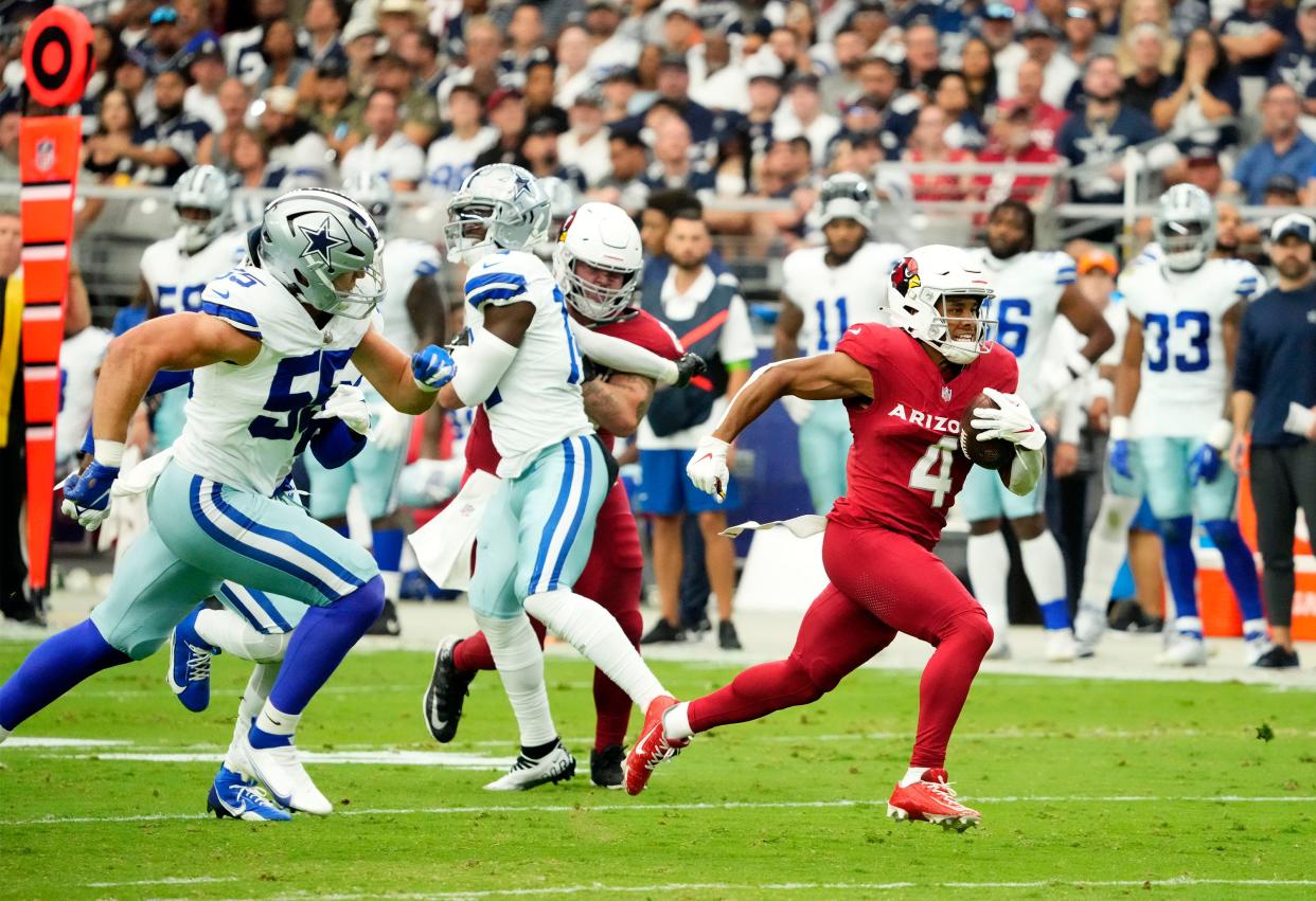 Arizona Cardinals wide receiver Rondale Moore (4) runs for a touchdown against the Dallas Cowboys in the first half at State Farm Stadium in Glendale on Sept. 24, 2023.