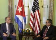 Chief of Mission at the U.S. Interests Section in Havana Jeffrey DeLaurentis (L) talks to Cuba's interim Foreign Minister Marcelino Medina in Havana July 1, 2015. REUTERS/Enrique de la Osa