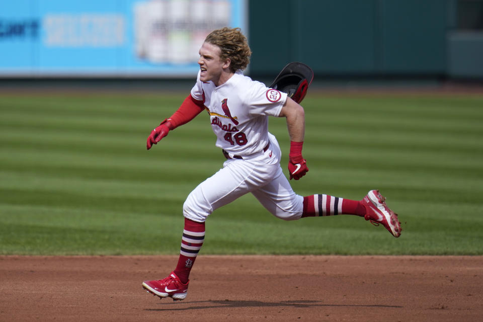 St. Louis Cardinals' Harrison Bader loses his helmet on his way to a triple during the third inning of a baseball game against the Milwaukee Brewers Sunday, Sept. 27, 2020, in St. Louis. (AP Photo/Jeff Roberson)