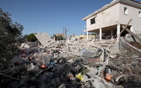 General view of the debris of a house after it completely collapsed after a gas leak explosion in a real state in the village of Alcanar, - Credit: JAUME SELLART/EPA