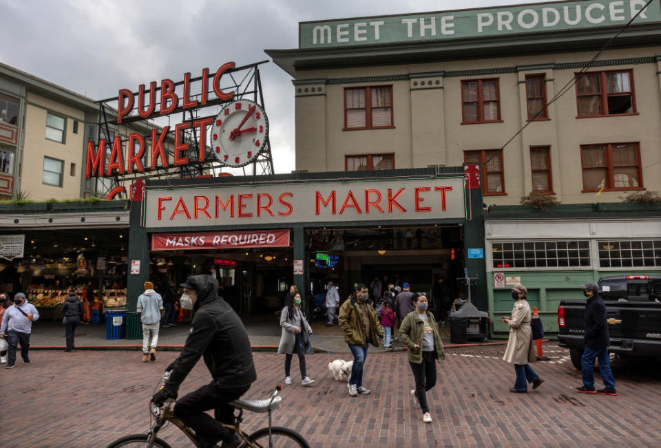 People walking by the outside of Pike's Place Market