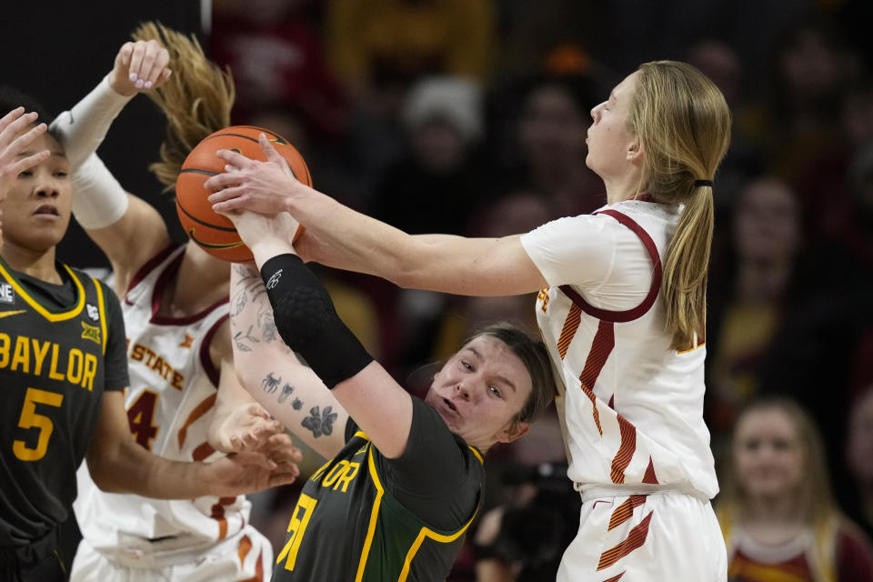 Baylor forward Caitlin Bickle fights for a rebound with Iowa State guard Emily Ryan, right, during the second half of an NCAA college basketball game, Saturday, Feb. 4, 2023, in Ames, Iowa. Baylor won 76-70. (AP Photo/Charlie Neibergall)