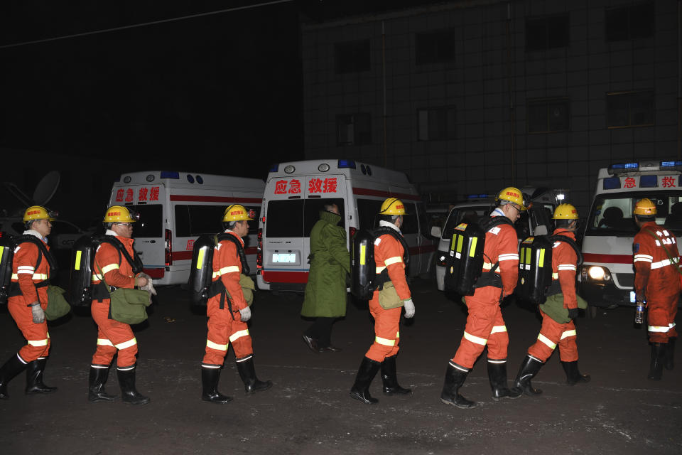 In this Nov. 18, 2019, photo released by China's Xinhua News Agency, rescuers prepare to enter a coal mine that was the site of a gas explosion in Pingyao county in northern China's Shanxi Province. Authorities in northern China say more than a dozen people were killed and others injured in a gas explosion inside a coal mine on Monday afternoon. (Yang Chenguang/Xinhua via AP)