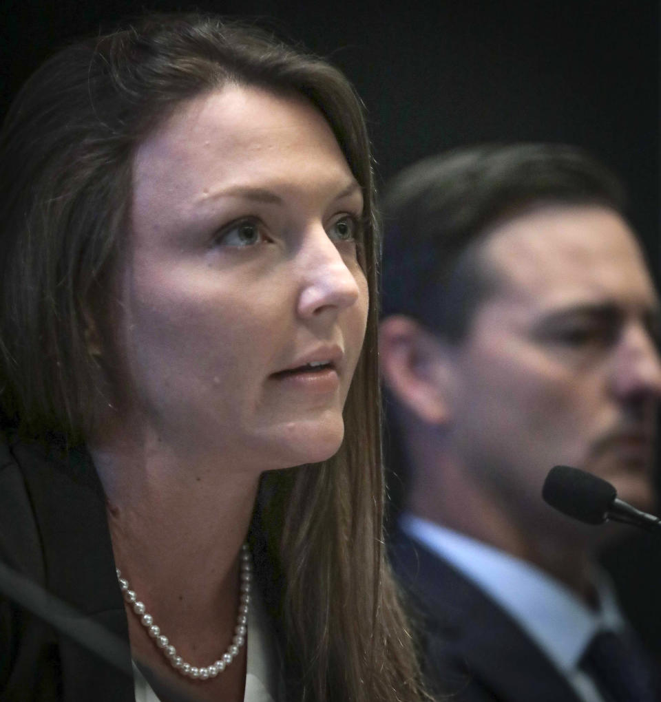 Courtney Wild, left, joined by her attorney Brad Edwards, reads a statement during a news conference, calling on victims of Jeffrey Epstein to contact the FBI or lawyers with their information, Tuesday, July 16, 2019, in New York. (AP Photo/Bebeto Matthews)