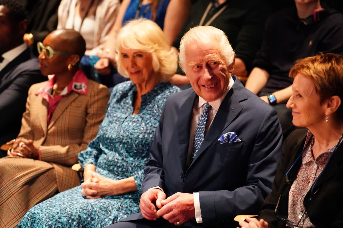 King and Queen Camilla sit int the audience at the  Royal Academy of Dramatic Art (Jordan Pettitt/PA Wire)