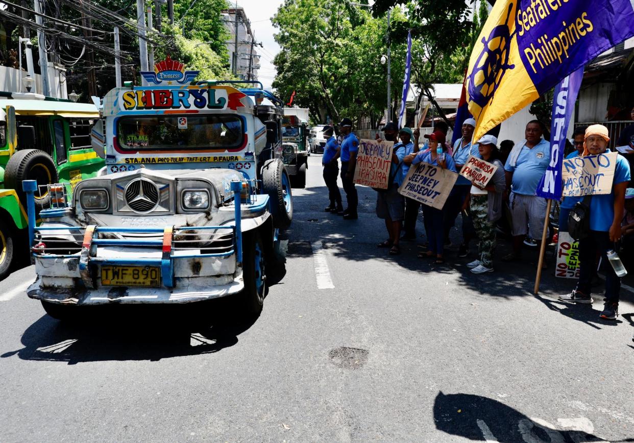 <span>Jeepney drivers stage a protest in front of the supreme court in Manila, Philippines. The noisy, smoke-belching vehicles face an existential threat from a plan to replace them with modern minibuses.</span><span>Photograph: Francis R Malasig/EPA</span>