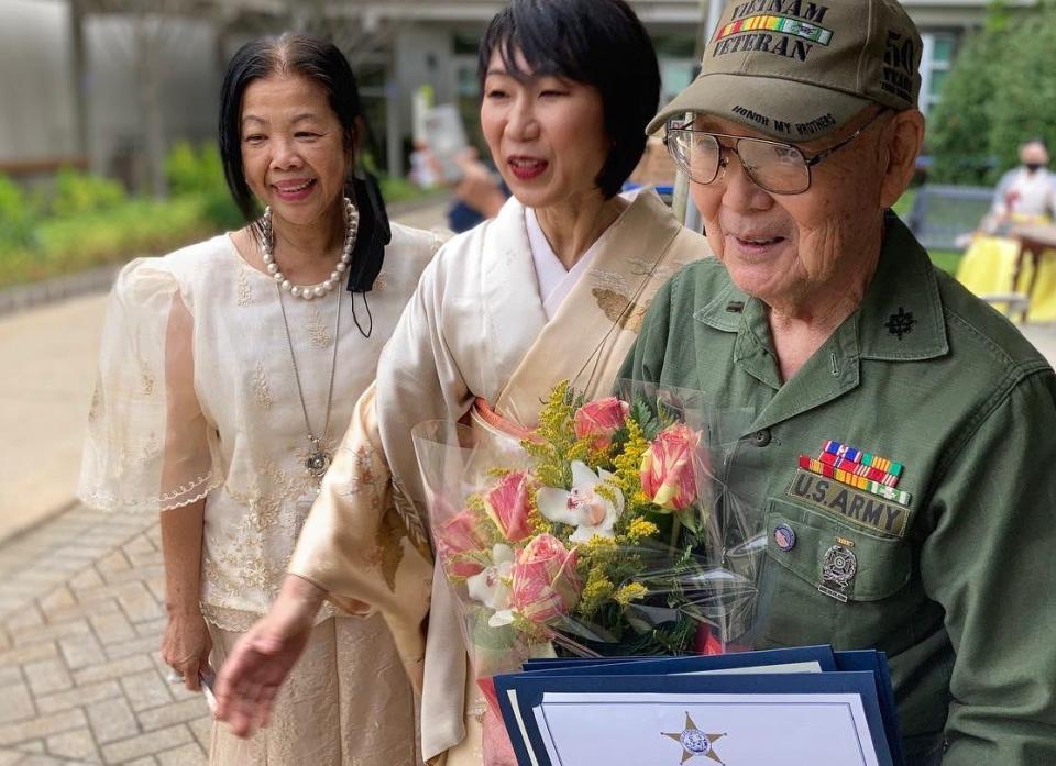 Takeshi Furumoto of Closter is congratulated by Ludi Hughes and Shinako Sudo of the Bergen County Asian Task Force during a ceremony in Hackensack.