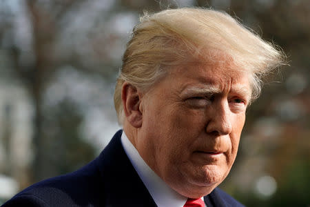 FILE PHOTO: U.S. President Donald Trump pauses as he speaks to the media on the South Lawn of the White House in Washington before his departure for the annual Army-Navy college football game in Philadelphia, U.S., December 8, 2018. REUTERS/Yuri Gripas/File Photo