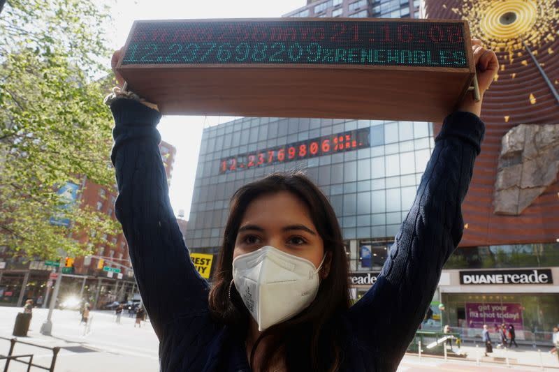 Climate activist Xiye Bastida protests in advance of Earth Day in front of the Climate Clock in New York