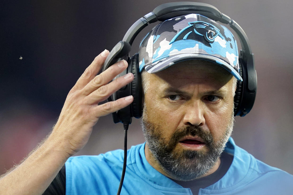 FILE - Carolina Panthers head coach Matt Rhule adjusts his ear phones in the first half of a preseason NFL football game against the New England Patriots, Friday, Aug. 19, 2022, in Foxborough, Mass. After six straight losing seasons and more than 20 years removed from its 1990s heyday, Nebraska is turning to Matt Rhule to rebuild its football program and make it competitive in the Big Ten Conference. (AP Photo/Charles Krupa, File)