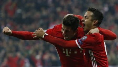 Football Soccer - Bayern Munich v Arsenal - UEFA Champions League Round of 16 First Leg - Allianz Arena, Munich, Germany - 15/2/17 Bayern Munich's Thiago Alcantara celebrates scoring their third goal with Robert Lewandowski Reuters / Michaela Rehle Livepic