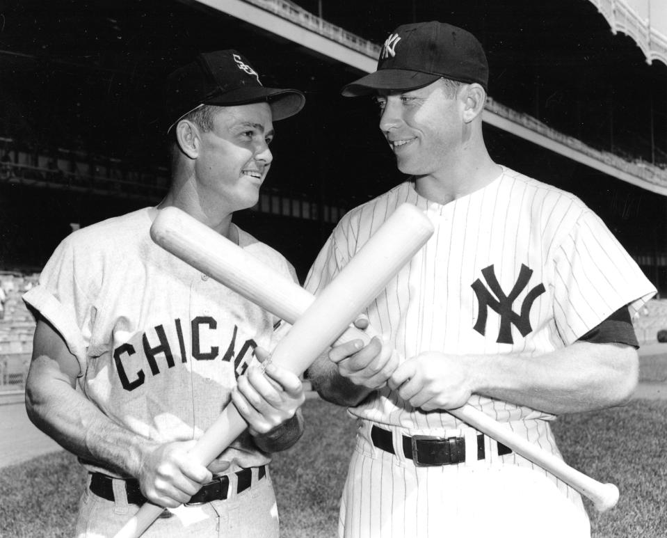 Nellie Fox, left, Chicago White Sox second baseman, and New York Yankees outfielder Mickey Mantle cross bats before start of game at Yankee Stadium in 1957. Fox was a 15-time All-Star, 3-time Gold Glove Award winner, and he won the American League MVP in 1959.