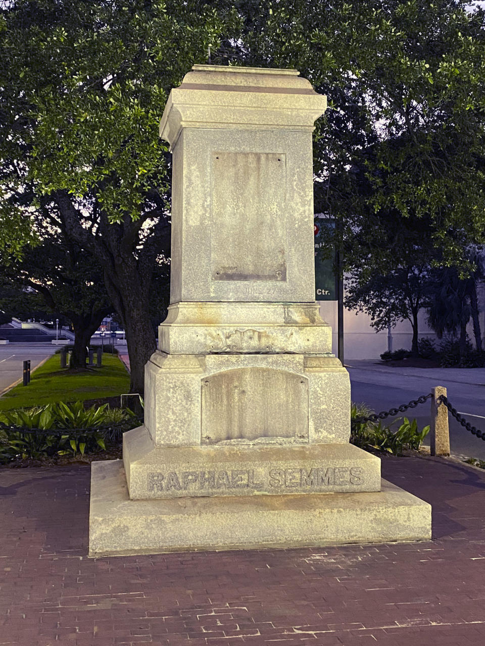 The pedestal where the statue of Admiral Raphael Semmes stands empty, early Friday, June 5, 2020 in Mobile, Ala. The city of Mobile  removed the Confederate statue early Friday, without making any public announcements. (WMPI-TV via AP)