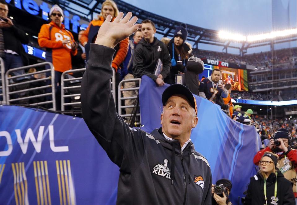 Denver Broncos head coach John Fox waves to the crowd as he walks on the field before the NFL Super Bowl XLVIII football game against the Seattle Seahawks Sunday, Feb. 2, 2014, in East Rutherford, N.J. (AP Photo/Paul Sancya)