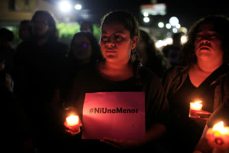 Activists take part in a demostration to protest violence against women and the murder of a 16-year-old girl in a coastal town of Argentina last week, at the Constitution monument in San Salvador, El Salvador, October 19, 2016. The sign reads, "Not one more". REUTERS/Jose Cabezas