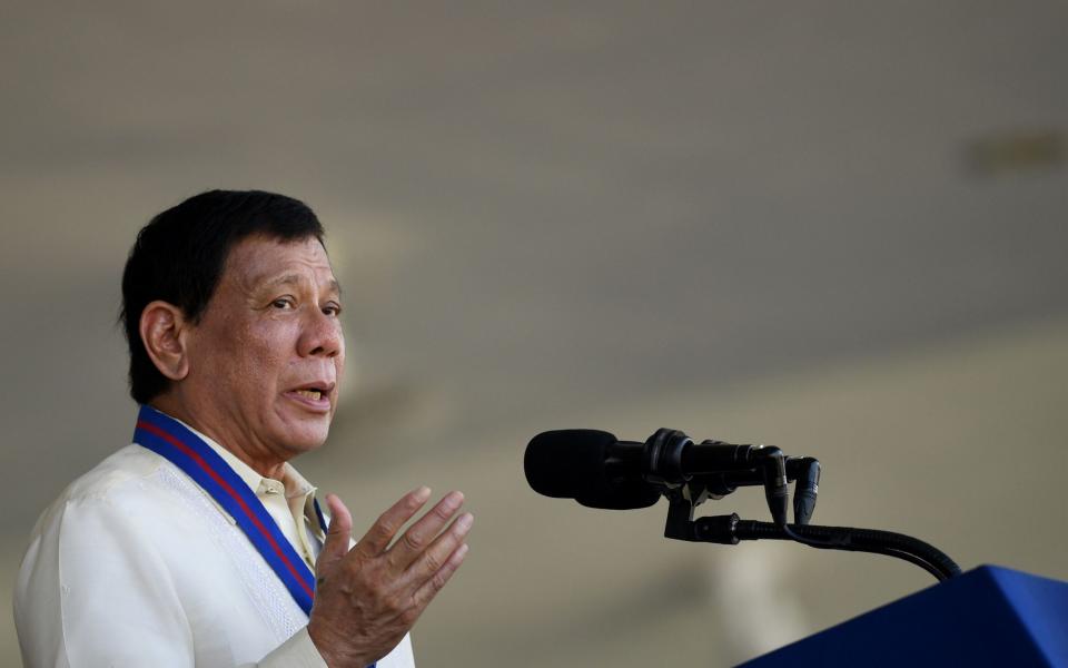 Philippine President Rodrigo Duterte gestures as he gives a speech during the 116th anniversary of the Philippine National Police (PNP) at its headquarters in Manila - AFP