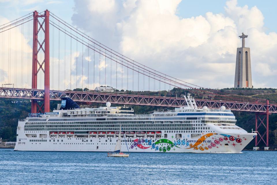 Norwegian Pearl cruise ship leaves Lisbon harbor