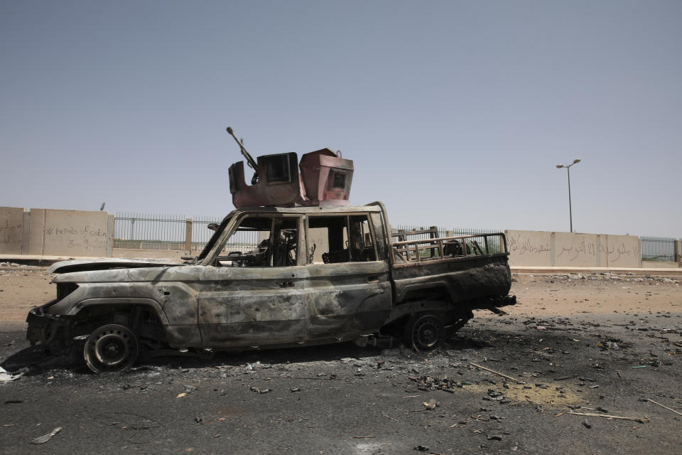 A destroyed military vehicle is seen in southern in Khartoum, Sudan, Thursday, April 20, 2023. The latest attempt at a cease-fire between the rival Sudanese forces faltered as gunfire rattled the capital of Khartoum. Through the night and into Thursday morning, gunfire could be heard almost constantly across Khartoum. (AP Photo/Marwan Ali)