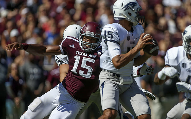 Sep 19, 2015; College Station, TX, USA; Texas A&M Aggies defensive lineman Myles Garrett (15) sacks Nevada Wolf Pack quarterback Tyler Stewart (15) during the first quarter at Kyle Field. Mandatory Credit: Troy Taormina-USA TODAY Sports