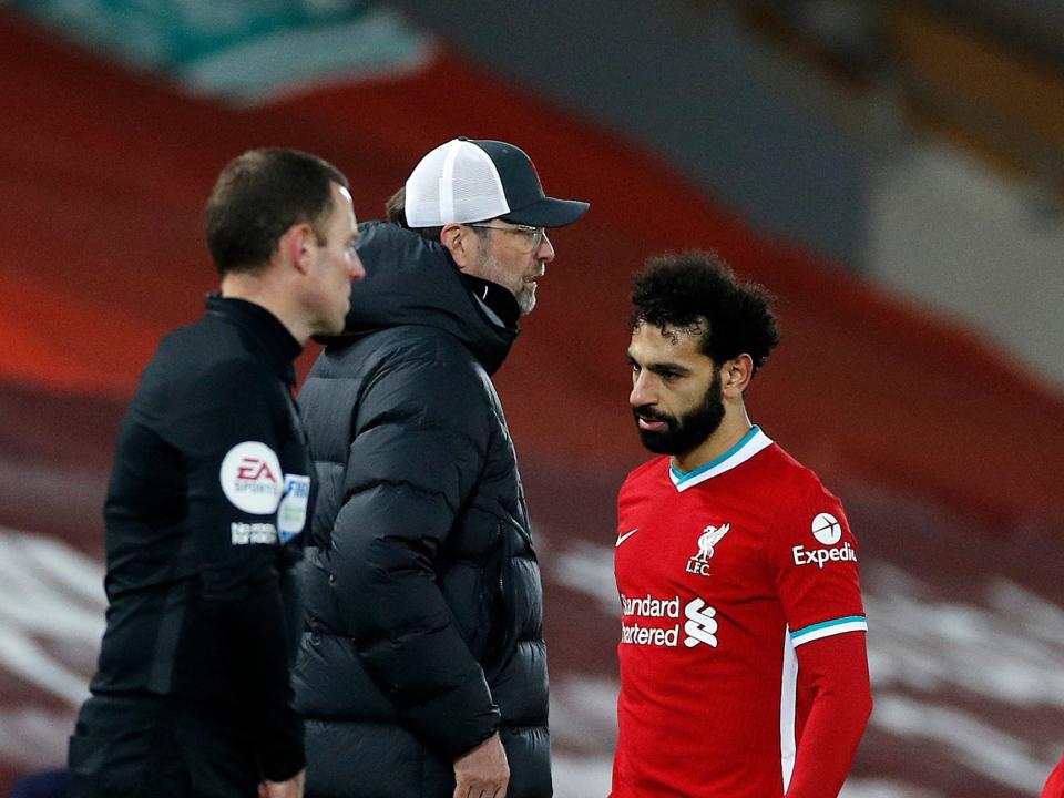 <p>Mohamed Salah walks past Jurgen Klopp after being substituted</p> (Getty)