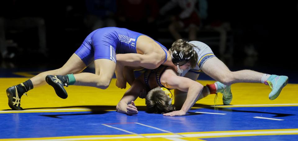 Wyatt Burns of Dundee (left) was named the Most Outstanding Wrestler at the 51st annual Monroe County Sheriff's Invitational Saturday after winning by technical fall over Jefferson's Ty Rose in the 126-pound finals.