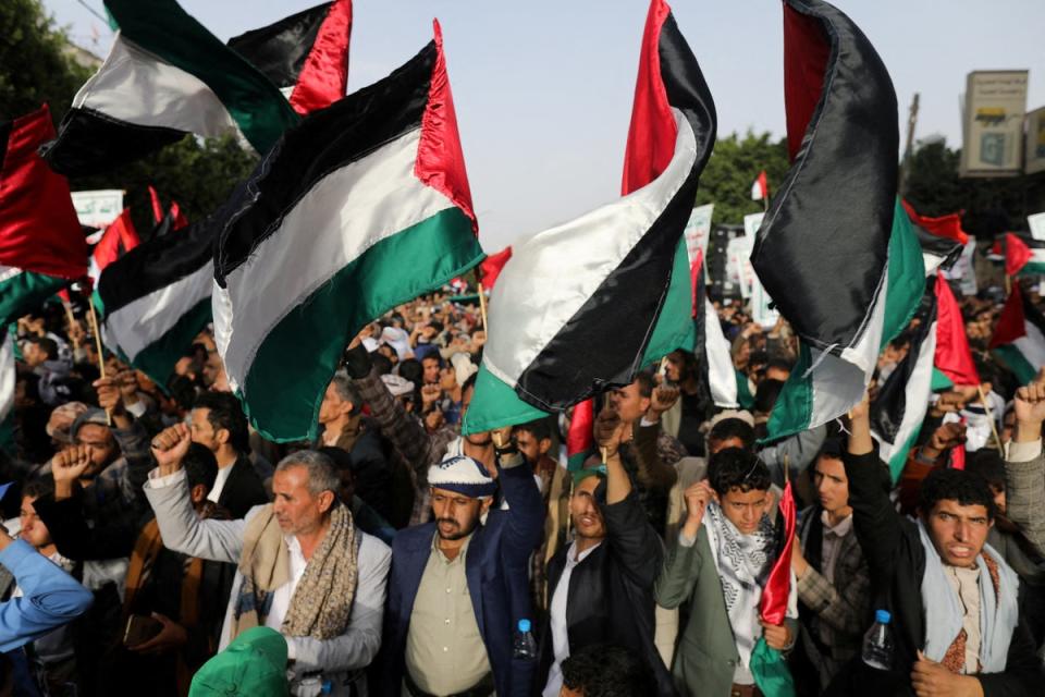 Houthi supporters rally to show support for Palestine in Sanaa, Yemen, on 7 October (REUTERS)