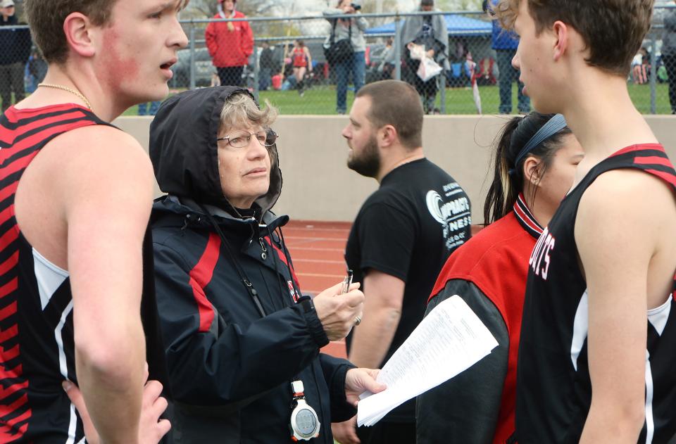 Northwestern High School track coach Sue Fargo, 73, talks to athletes near the finish line during the Harbor Creek track and field invitational at Paul J. Weitz Stadium in Harborcreek Township on April 23. Fargo has been coaching for 51 years.