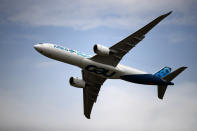 An Airbus A350 performs a demonstration flight at Paris Air Show, in Le Bourget, north east of Paris, France, Tuesday, June 18, 2019. The world's aviation elite are gathering at the Paris Air Show with safety concerns on many minds after two crashes of the popular Boeing 737 Max. (AP Photo/ Francois Mori)