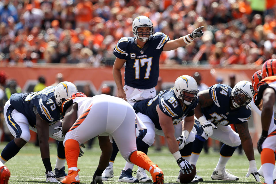 <p>Philip Rivers #17 of the Chargers calls a play at the line of scrimmage during the first quarter of the game against the Cincinnati Bengals at Paul Brown Stadium on September 20, 2015 in Cincinnati, Ohio. (Photo by Andy Lyons/Getty Images) </p>