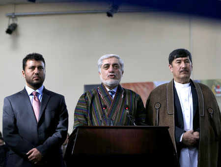 Afghanistan's Chief Executive Abdullah Abdullah, alongside his two vice-presidential candidates Enayatullah Babur Farahmand (L) and Asadullah Saadati (R), arrives to register as a candidate for the upcoming presidential election at the Afghanistan's Independent Election Commission (IEC) in Kabul, Afghanistan January 20, 2019.REUTERS/Omar Sobhani