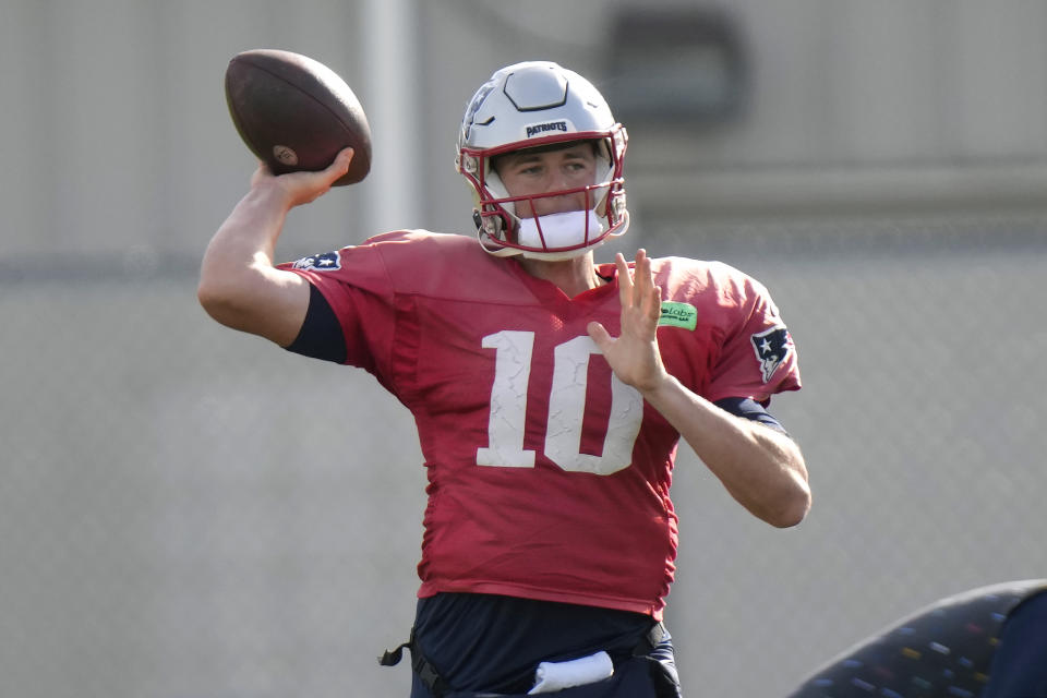 New England Patriots quarterback Mac Jones winds up to pass during an NFL football practice, Wednesday, Nov. 15, 2023, in Foxborough, Mass. (AP Photo/Steven Senne)