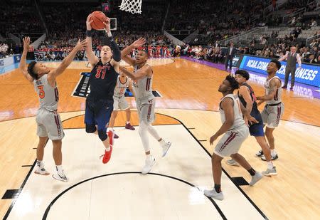 Mar 24, 2019; San Jose, CA, USA; Liberty Flames forward Scottie James (31) shoots against Virginia Tech Hokies guard Wabissa Bede (3) during the first half in the second round of the 2019 NCAA Tournament at SAP Center. Mandatory Credit: Kyle Terada-USA TODAY Sports