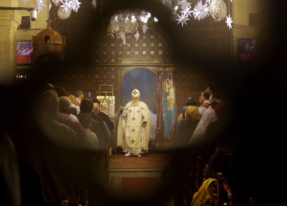 Bishop Aclimandos leads Coptic Christmas Eve mass at the Virgin Mary church in Cairo, Egypt, Monday, Jan. 6, 2014. Egypt's Coptic Christians, who make up about 10 percent of the country's 90 million people, are the largest Christian community in the Middle East. (AP Photo/Amr Nabil)