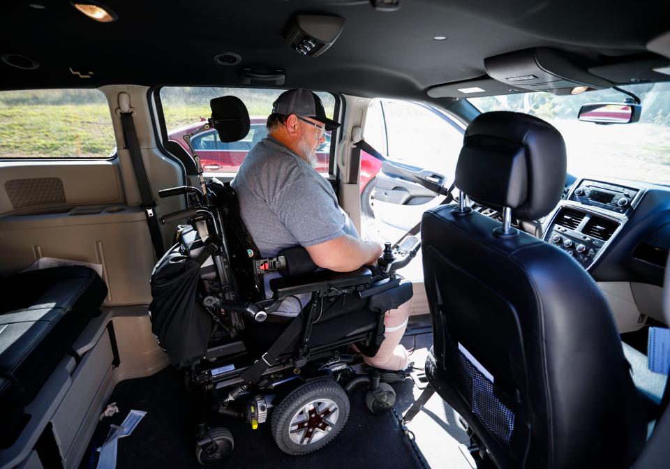 Jason Wendlandt demonstrates how his handicap-accessible van works. Wendlandt used funds raised by the community to purchase both hand controls for the van and a trackchair.